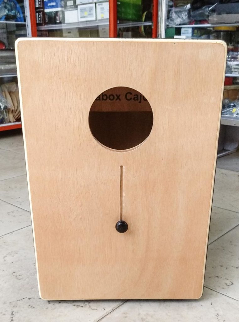 The back of a FaBox cajon showing the sound hole adjustment mechanism.