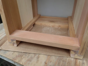 Interior of the Open Hearth model showing the bass port bar in front and the lower panel on the bottom towards the back of the cajon.